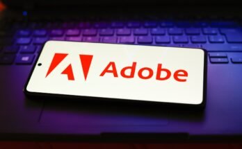 The Adobe Inc. logo displayed on a smartphone screen.