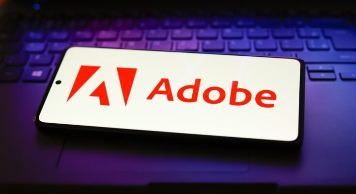 The Adobe Inc. logo displayed on a smartphone screen.