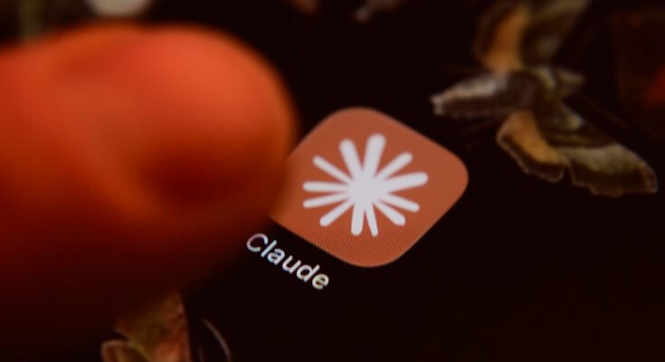 The Claude app icon is displayed on a smartphone screen