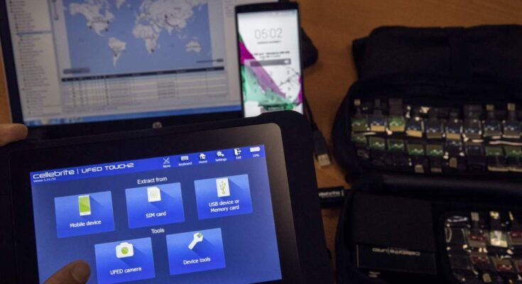 An engineer shows devices and explains the technology developed by the Israeli firm Cellebrite.