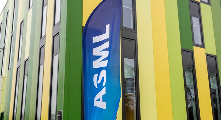 A banner flag with the ASML logo outside the Brainport Industries Campus, which houses the ASML Academy, in Eindhoven, Netherlands.