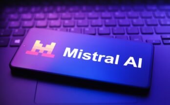 The Mistral AI logo appears on a smartphone screen in this photo illustration