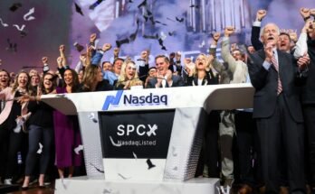 Bret Johnsen (C), SpaceX Chief Financial Officer, and Gwynne Shotwell (center R), SpaceX President and Chief Operating Officer, celebrate as they ring the opening bell at the Nasdaq MarketSite to celebrate the launch of SpaceX’s initial public offering (IPO) in New York on June 12, 2026.