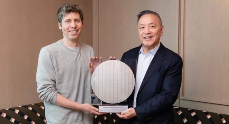 The CEOs of OpenAI and Broadcom stand flanking a circular semiconductor wafer.