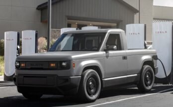 Slate Auto's Blank Slate truck charging at a Tesla Supercharger