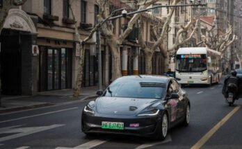 Tesla Model 3 vehicle drives on the street on February 27, 2025 in Shanghai, China.
