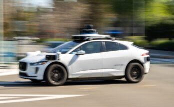 A Waymo autonomous taxi outside the Google headquarters