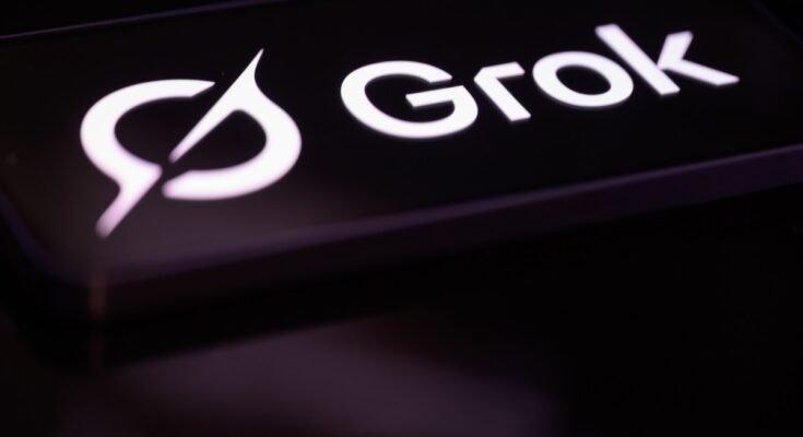 The Grok logo is displayed on a mobile phone screen